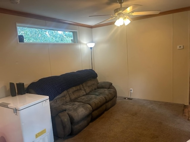 carpeted bedroom with ceiling fan, ornamental molding, and white fridge