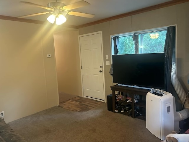 carpeted living room featuring a ceiling fan