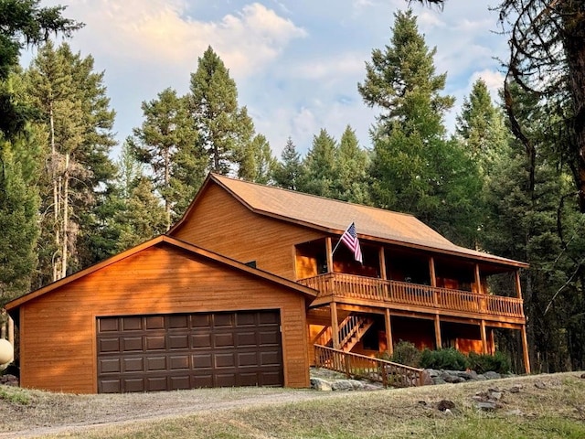 log home featuring a garage