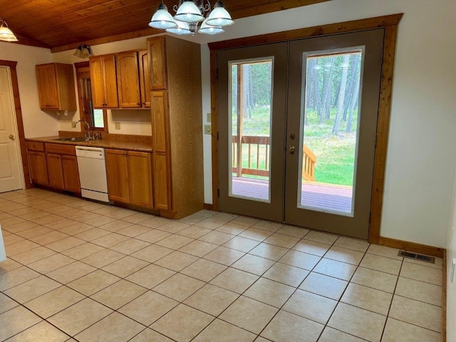 kitchen with white dishwasher, wooden ceiling, light tile patterned floors, decorative light fixtures, and sink