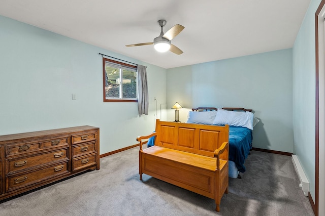 bedroom with a baseboard radiator, baseboards, a ceiling fan, and light colored carpet