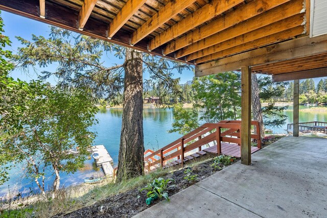 water view featuring a boat dock and a mountain view