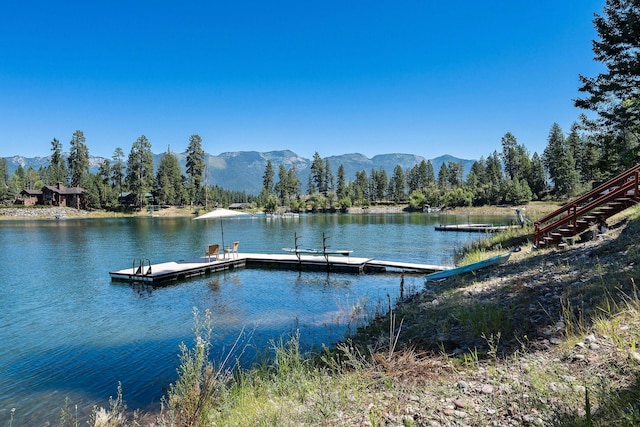 dock area featuring a water and mountain view