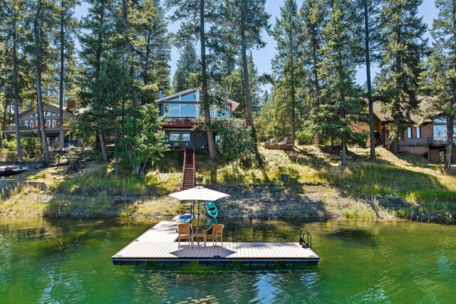 dock area with a water and mountain view