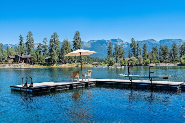 dock area featuring a water and mountain view