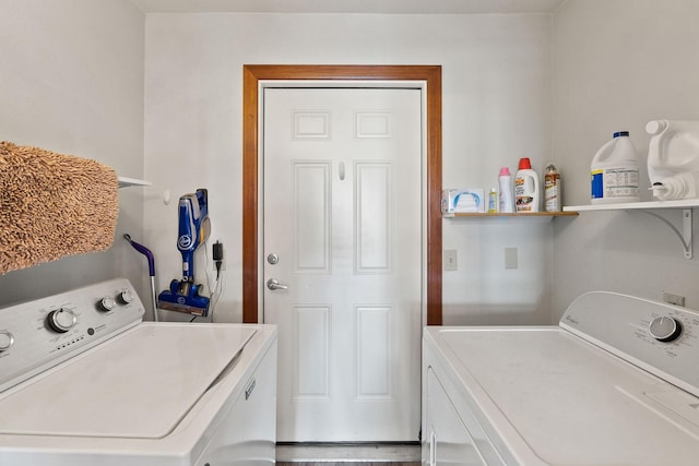 clothes washing area with laundry area and separate washer and dryer