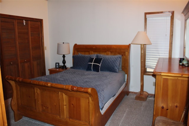 bedroom featuring a closet and carpet flooring