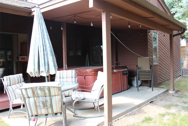 220 Fox Farm Dr, Whitefish, MT 59937 - view of patio featuring a hot tub and outdoor dining space