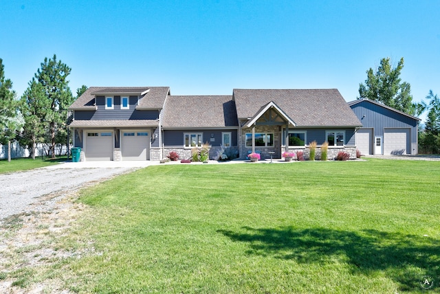 craftsman-style home featuring a garage and a front lawn