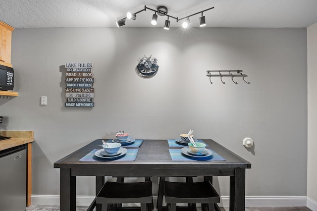 dining space featuring baseboards