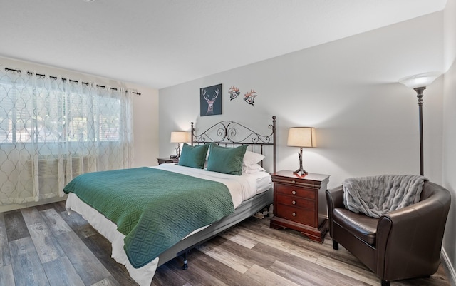 bedroom featuring wood finished floors