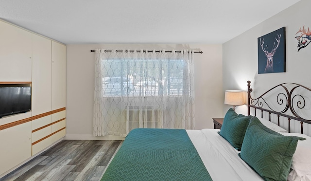 bedroom with wood finished floors