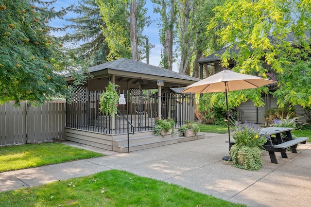 view of home's community featuring a gazebo, a patio area, and fence