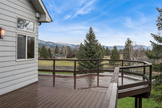 wooden deck featuring a mountain view