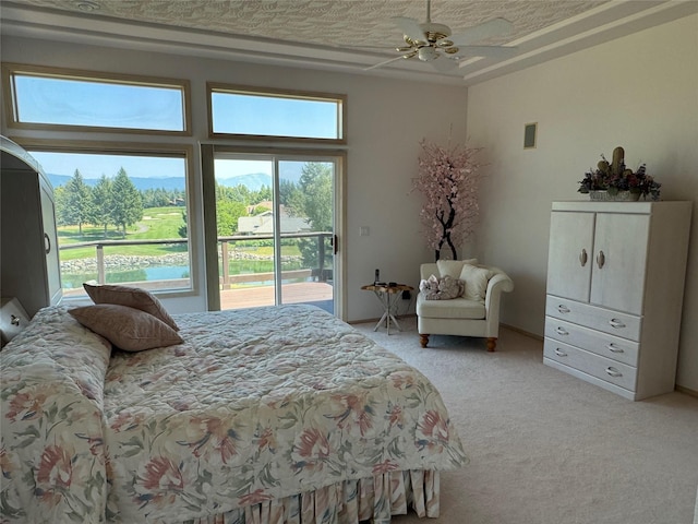 carpeted bedroom with access to outside and ceiling fan