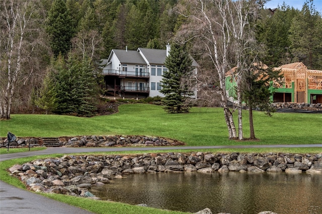exterior space featuring a wooded view