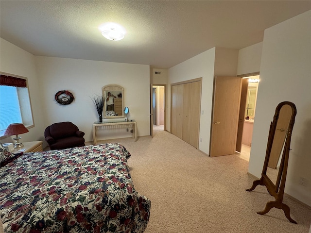 carpeted bedroom with a textured ceiling