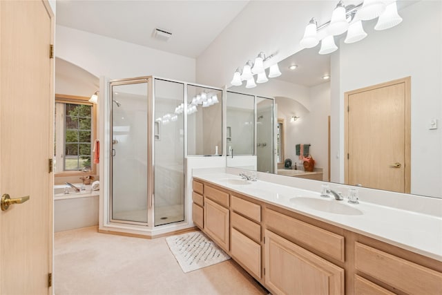full bath featuring double vanity, visible vents, a bath, and a shower stall