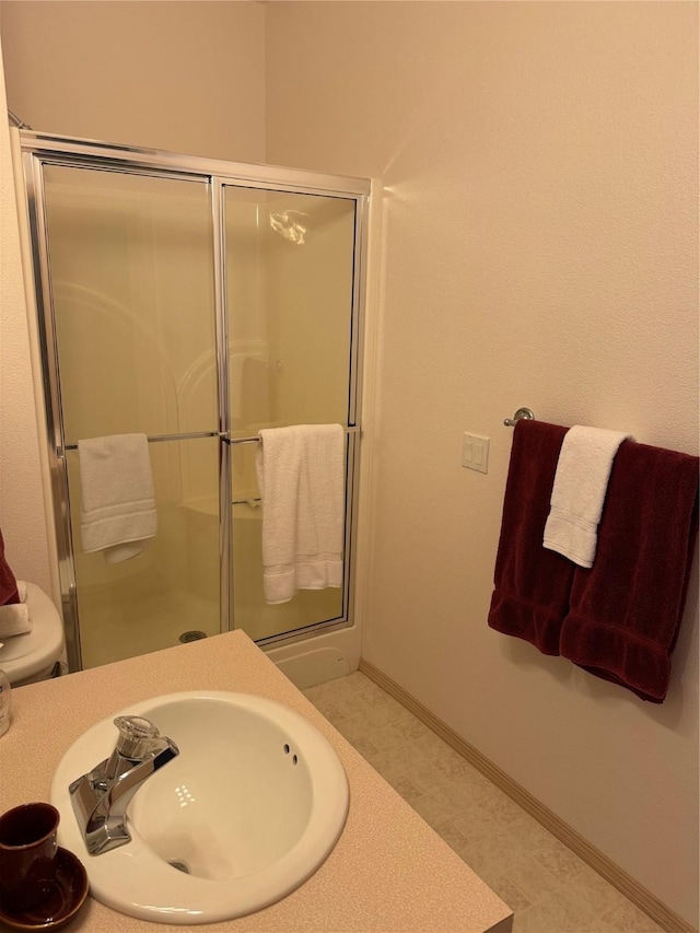 bathroom with sink and walk in shower