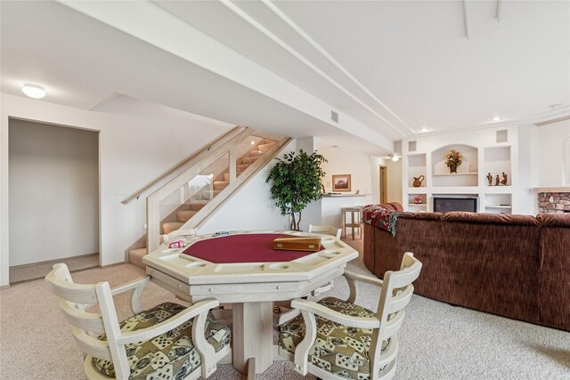 playroom with built in features, visible vents, and light colored carpet