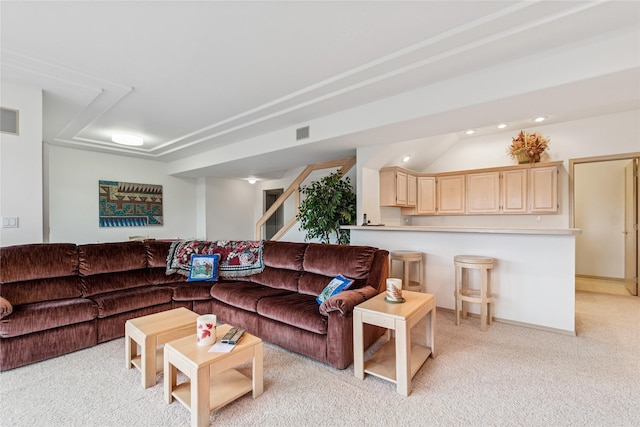 living room with stairs, visible vents, light colored carpet, and recessed lighting