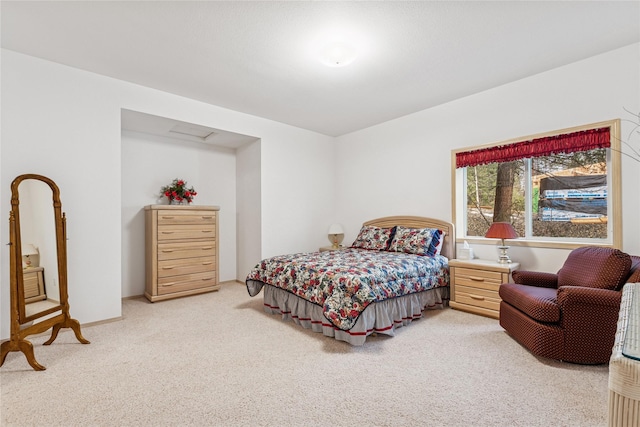 bedroom featuring light carpet