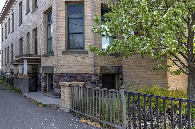 view of property with fence