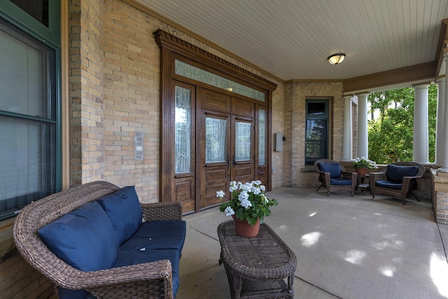 view of patio / terrace featuring french doors and a porch