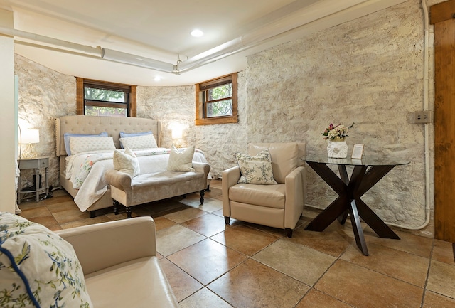 tiled bedroom with a raised ceiling