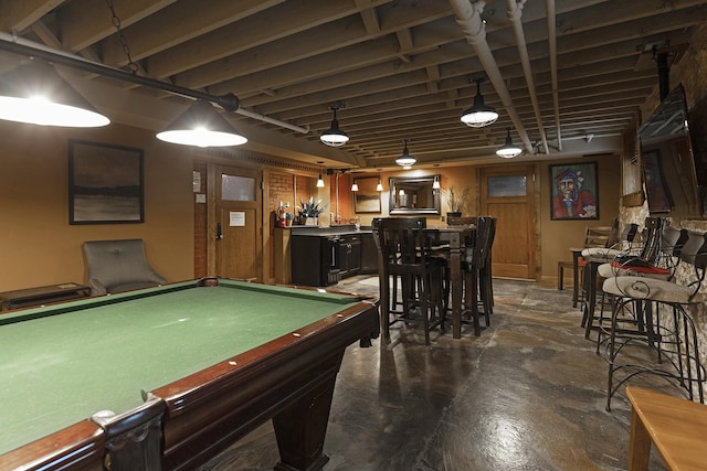 game room with pool table, bar area, and concrete floors