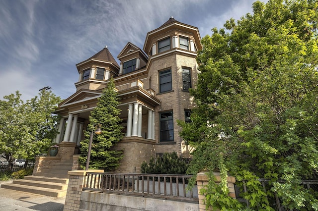 view of front of house featuring brick siding