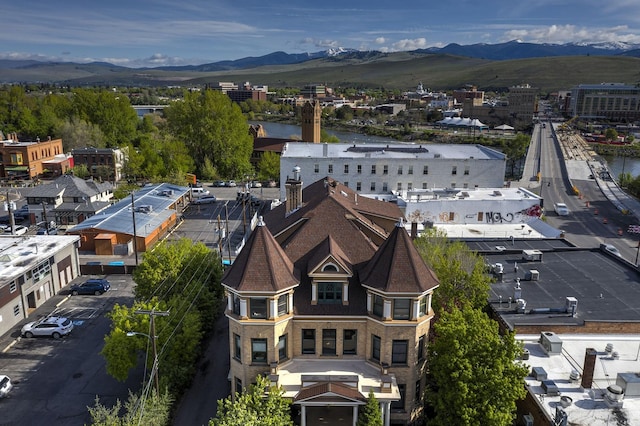 birds eye view of property featuring a mountain view