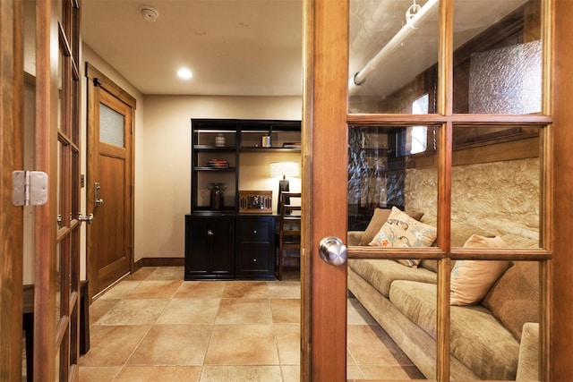 interior space featuring baseboards