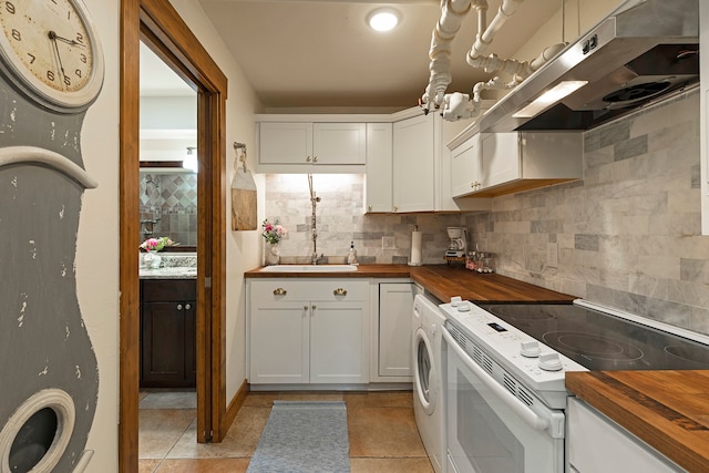 kitchen with butcher block counters, white electric range, sink, light tile patterned floors, and backsplash