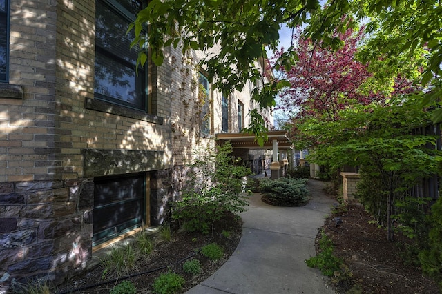 view of side of property with brick siding