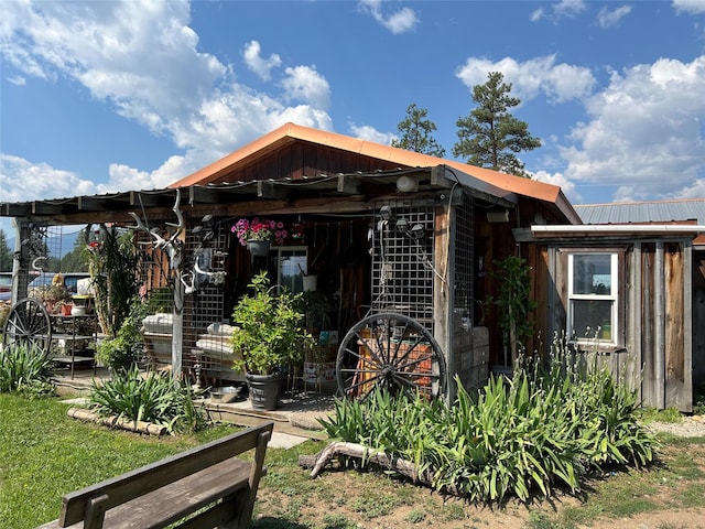 view of front of property featuring metal roof and board and batten siding