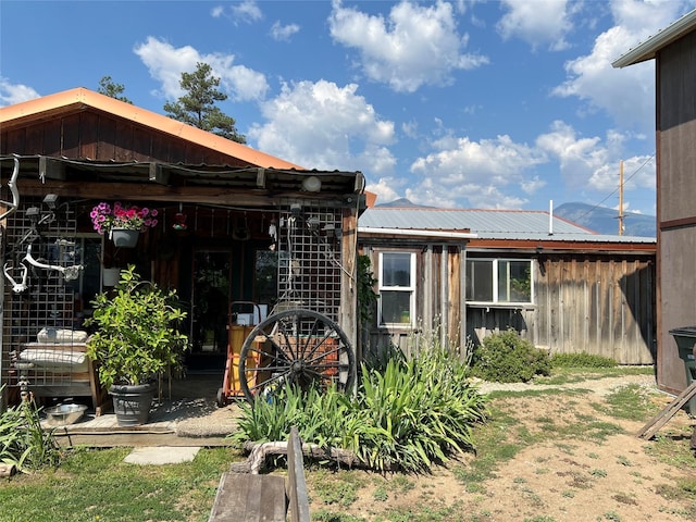 exterior space with metal roof and board and batten siding