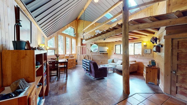 living room featuring wood ceiling, wooden walls, and vaulted ceiling with beams