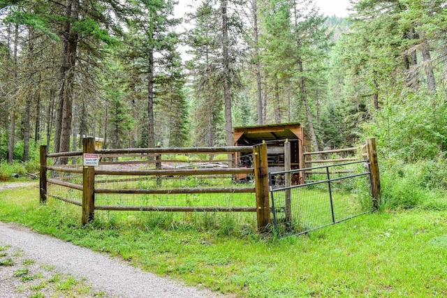 view of gate with an outdoor structure