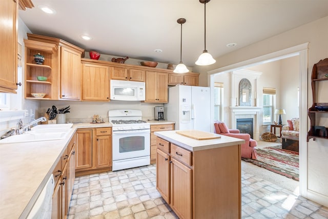 kitchen with a sink, light countertops, recessed lighting, white appliances, and open shelves