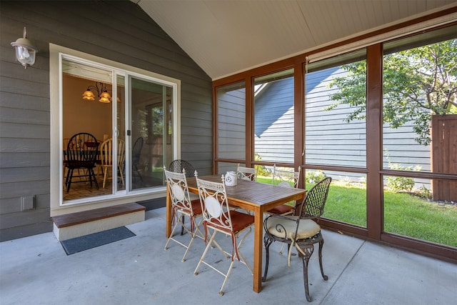 sunroom featuring lofted ceiling