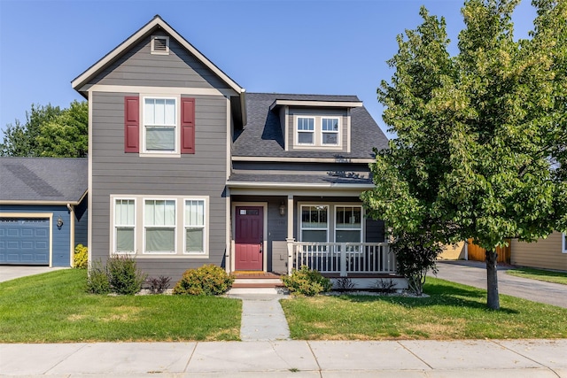 view of front of property featuring a porch, a shingled roof, and a front yard