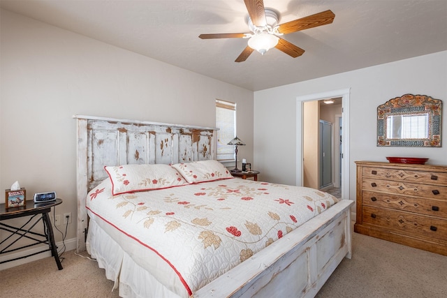 bedroom featuring a ceiling fan and light colored carpet