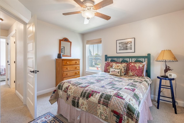 bedroom with baseboards, light carpet, and ceiling fan