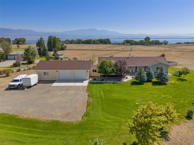 birds eye view of property featuring a mountain view and a rural view