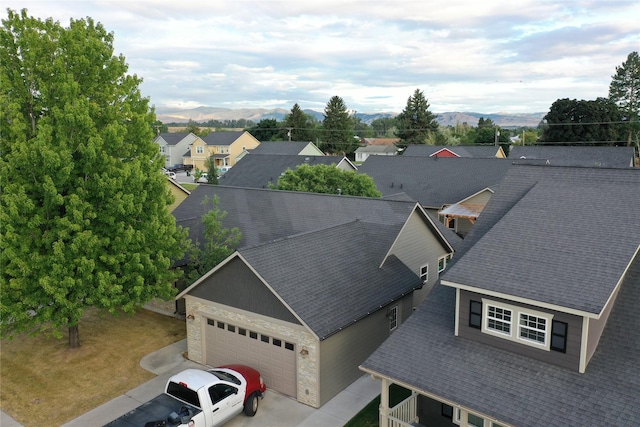 birds eye view of property with a residential view and a mountain view