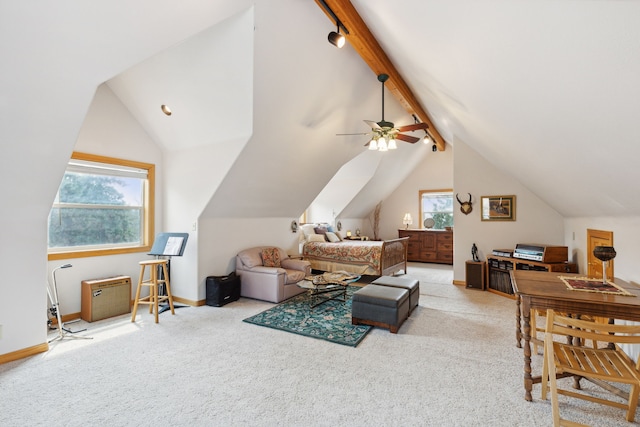 carpeted living room featuring ceiling fan, vaulted ceiling with beams, and a healthy amount of sunlight