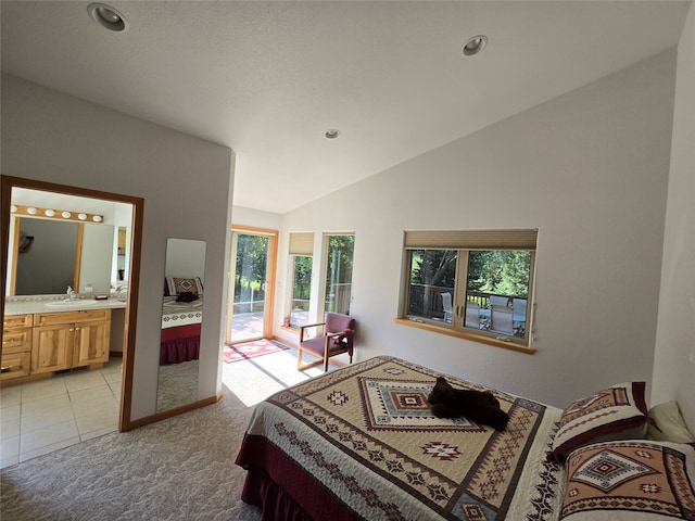 carpeted bedroom with lofted ceiling, connected bathroom, access to exterior, and sink