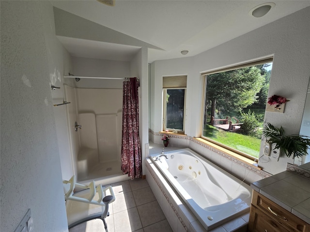 bathroom with vanity, tile patterned flooring, and shower with separate bathtub