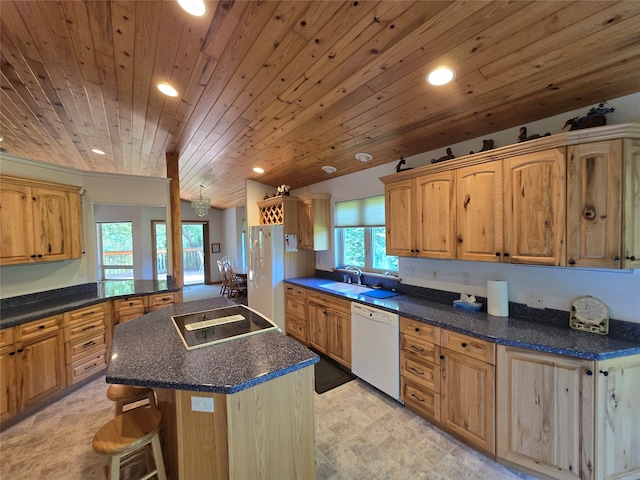 kitchen with black electric stovetop, dishwasher, a center island, wood ceiling, and a breakfast bar area